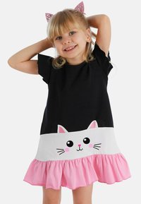 Mustahar black cotton dress with short sleeves, in which a white ruffle hem and a cat face design are accented with pink details, along with a pink ruffled skirt.