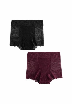 Zwei Paare hochgeschnittener Damenunterwäsche aus Spitze, ein schwarzes und ein bordeauxfarbenes, mit floralen Mustern und gewellten Kanten.