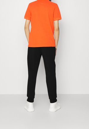 Pantalones deportivos - black