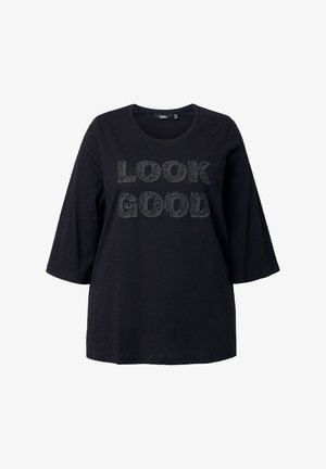 Černé tričko s krátkými rukávy s nápisem "LOOK GOOD" v dekorativním písmu. Vyrobeno z měkké látky s volným střihem.