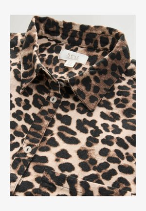 Leopard print shirt made of linen, featuring a collared neck, button closure, and shades of brown, black, and beige in a soft texture.