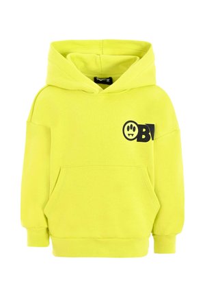 Sweat-shirt à capuche en tissu jaune doux, comportant une poche avant et un graphique avec un visage souriant et des accents noirs.