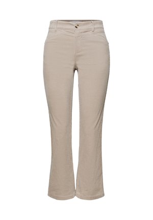 Beige fløjlsbukser med forlommer, bæltestropper og knaplukning, med en let udvidelse ved anklerne.