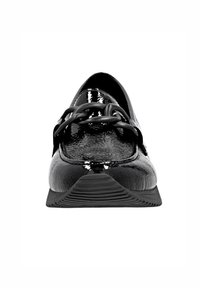 Black patent leather shoe with a rounded toe and textured surface. Features a decorative black chain across the instep and a textured outsole.