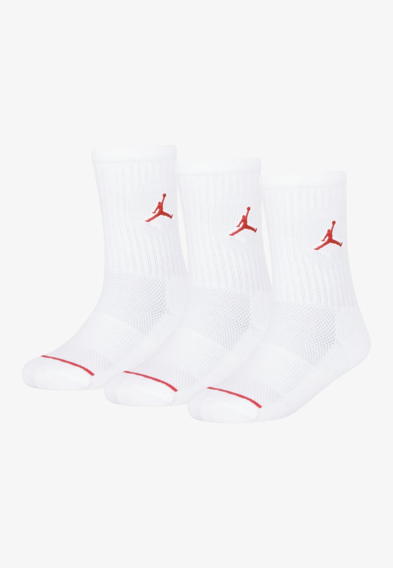 Trois paires de chaussettes blanches en coton mélangé, avec des accents rouges, une texture côtelée et un logo Jumpman rouge brodé.