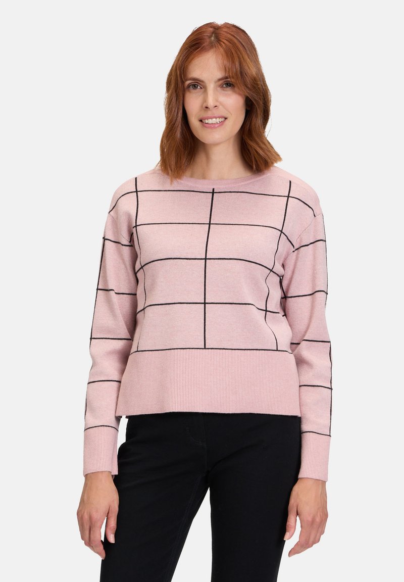 Rosa Pullover-Sweater mit einem in Schwarz umrandeten Karomuster. Rundhalsausschnitt, lange Ärmel und gerippter Saum. Der Stoff wirkt weich und strapazierfähig.