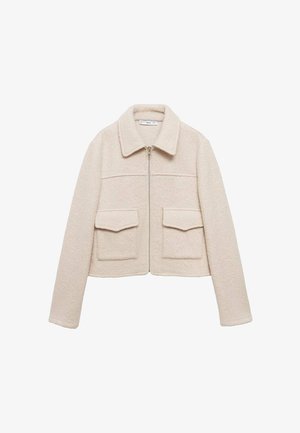 Kremowa polarowa kurtka z pełnym zamkiem błyskawicznym z przodu, dwiema kieszeniami z klapami, długimi rękawami i szerokim kołnierzem.