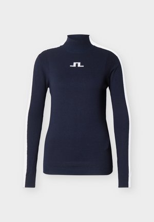 Tumši zils garām piedurknēm silta džempera ar baltām sānu svītrām un mazu baltu ģeometrisku logotipu uz krūtīm.