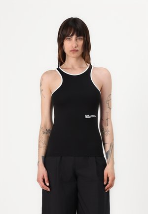 Black sleeveless top with white trim, featuring a fitted design and a logo on the lower front. Smooth fabric with a slight sheen.