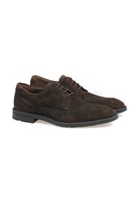 Braune Wildlederschuhe mit glatter Textur, runder Spitze und dekorativer Naht. Sie haben eine schwarze Gummisohle und braune Schnürsenkel.