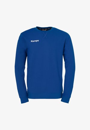 Blå sweatshirt med rund halsudskæring, lange ærmer, ribbet manchetter og kant, med "Kempa"-logo trykt i hvidt på fronten. Blød stoftekstur.