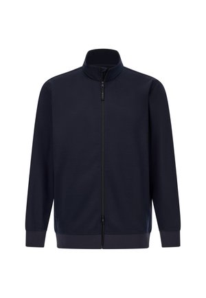 Chaqueta navy con cierre y cuello alto, hecha de tejido suave. Presenta puños y dobladillo elásticos, con un diseño minimalista sin patrones.