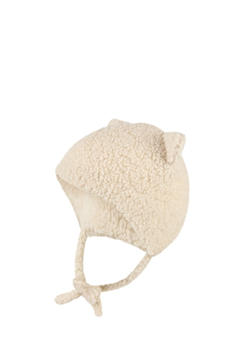 Soft cream-colored fleece baby hat with ear flaps, tied chin straps, and small decorative ears on top.