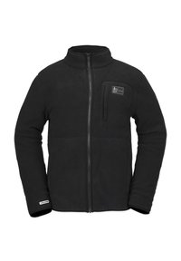 Chaqueta de forro polar negra con cierre delantero, cuello alto y un bolsillo en el pecho. Presenta una textura suave y una etiqueta de logo cerca del dobladillo.