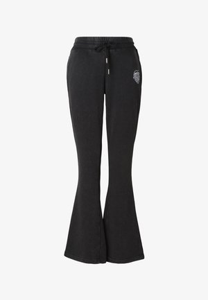 Černé rozšířené tepláky z měkké látky, s elastickým pasem se stahovací šňůrkou a malým grafickým detailem na boku.