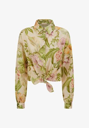Camisa corta de estampado floral en tejido ligero, con flores verdes, rosas y naranjas sobre un fondo beige claro, detalle de nudo en el frente.