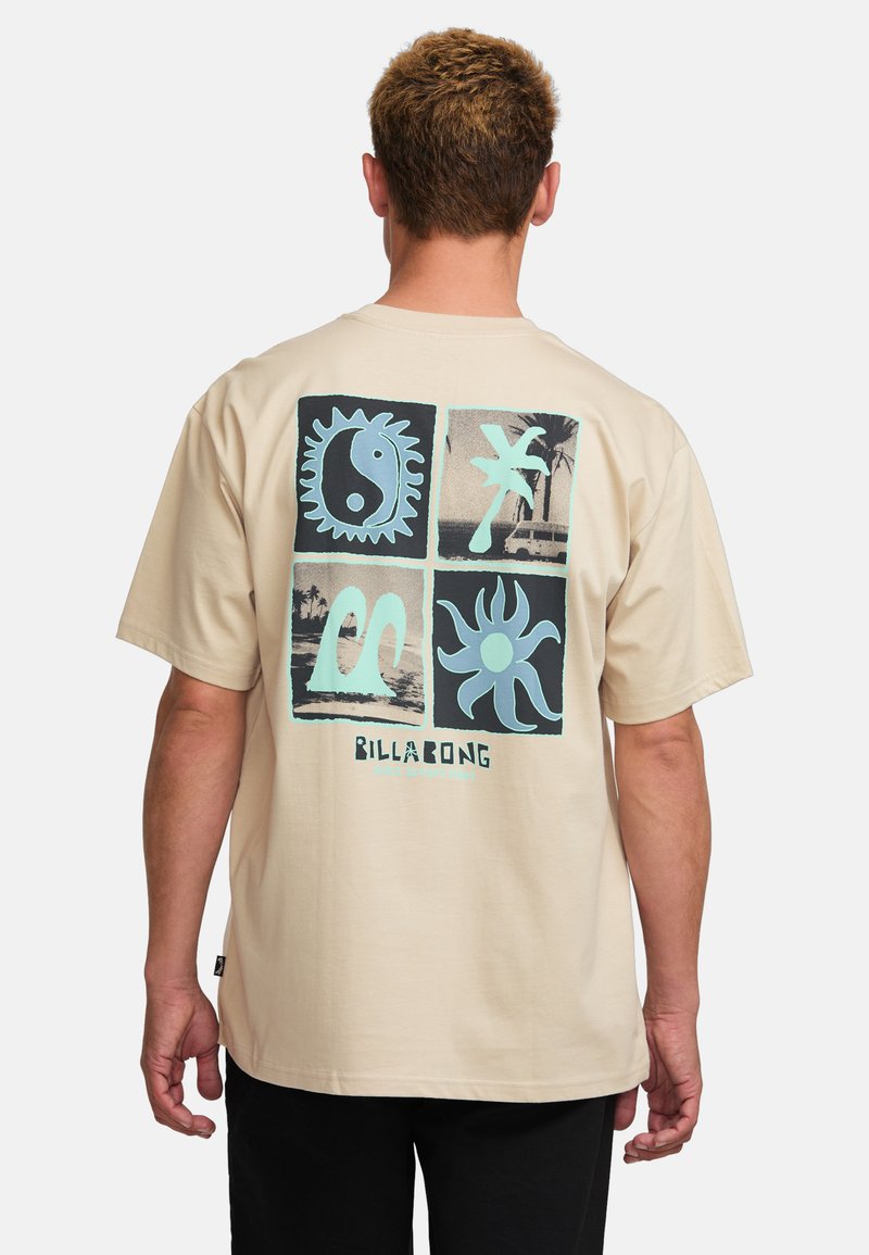 Beige short-sleeve t-shirt featuring a multi-panel graphic print on the back in blue and black with the "Billabong" logo at the bottom.