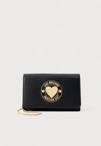 Black leather wallet with a gold heart logo and chain strap. Features a flap closure and smooth texture with visible stitching.