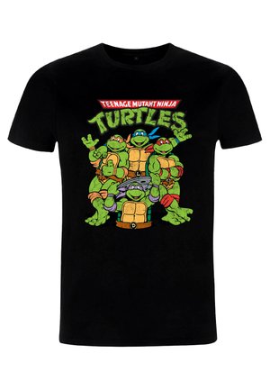 T-shirt en coton noir avec des graphiques vibrants de style cartoon représentant quatre tortues vertes, portant des masques colorés et posant, avec du texte au-dessus.