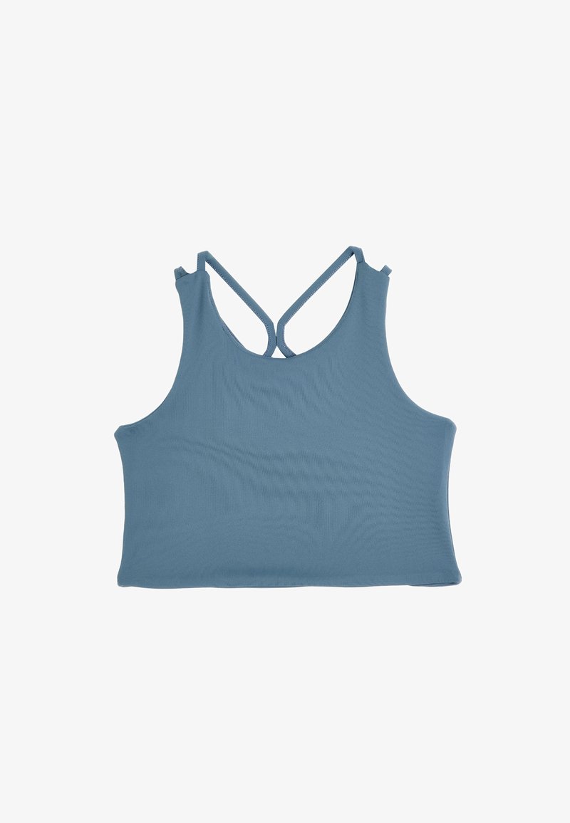 Niebieski top w kropeczki wykonany z miękkiego, gładkiego materiału. Posiada krzyżujące się ramiączka na plecach. Prosta i dopasowana sylwetka.