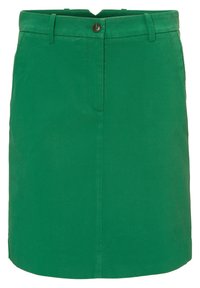 Mini-jupe en coton verte avec passants de ceinture, fermeture à bouton et détail de couture à l'avant.