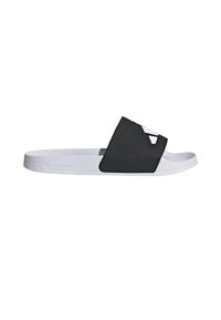 Black slide sandal with a wide strap featuring a geometric cutout and a white rubber sole. Material appears smooth and lightweight.