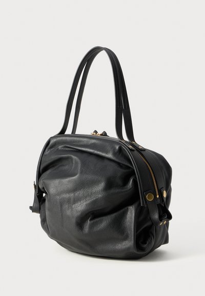 Black leather bag with a textured finish. Features a rounded shape, dual top handles, and a gold zipper closure. Accents include brass hardware.