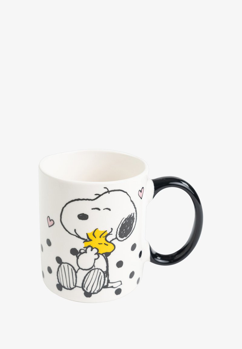Weißer Keramikkrug mit schwarzem Henkel, versehen mit Illustrationen von Snoopy und Woodstock, rosa Herzen und schwarzen Punkten auf der Oberfläche.
