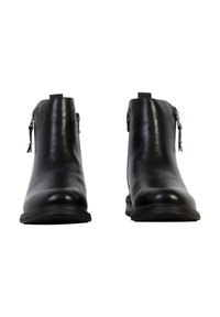 Paire de bottines en cuir noir avec fermetures éclair latérales vues de face sur un fond blanc.