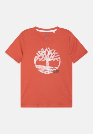 T-shirt en coton orange avec un graphique d'arbre blanc et un logo. Col rond, manches courtes et texture lisse.