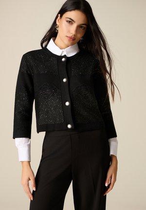 CORTA LAVORATA - Vest - nero