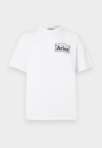 T-shirt en coton blanc à manches courtes, avec un logo texte "Aries" en contour noir sur la poitrine gauche, dans un design rectangulaire.