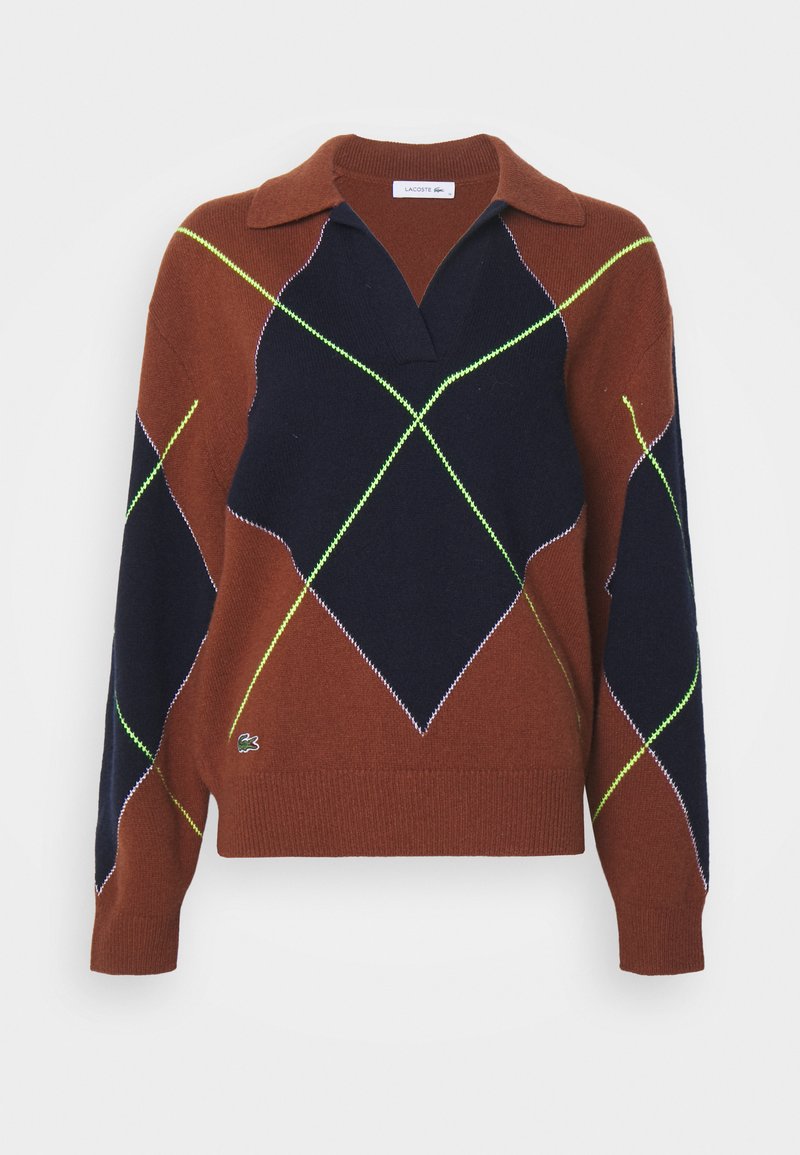 Pull marron et bleu marine avec un col, présentant un motif en losanges en vert néon et des coutures blanches. Inclut un petit logo.