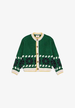 Zielony wełniany kardigan z geometrycznymi białymi i granatowymi wzorami, kremowym zapięciem na guziki i żółtymi wykończeniami na kołnierzyku i u dołu. Drewniane guziki.