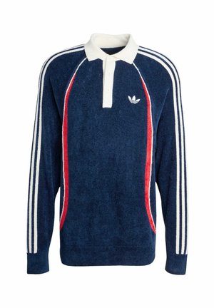 Námořnický pulovr s bílými a červenými pruhy, žebrovanými manžetami a bílým límečkem. Na hrudi je vyšívané logo. Jemná textura.