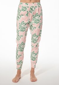 Floral print pyjamabroek van zacht materiaal, met roze tulp- en groene bladpatronen op een lichte achtergrond; taps toelopende pasvorm met elastische tailleband.