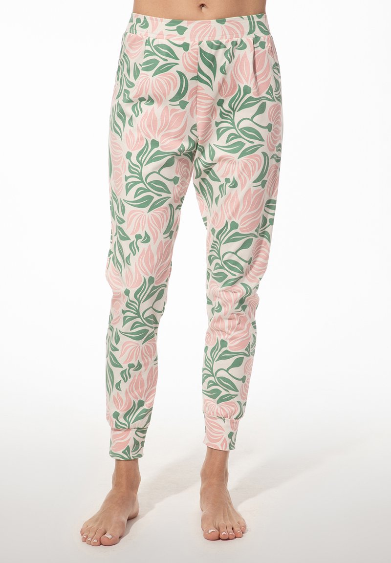 Floral print pyjamabroek van zacht materiaal, met roze tulp- en groene bladpatronen op een lichte achtergrond; taps toelopende pasvorm met elastische tailleband.
