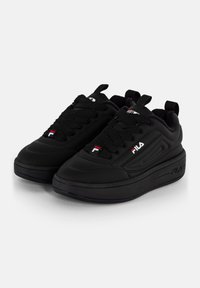 Black athletic shoes with a smooth, synthetic upper, round toe, thick sole, textured laces, and logo accents on the tongue and side.