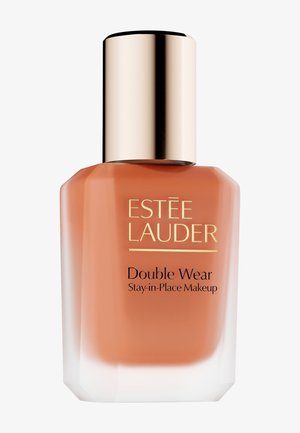 Estee Lauder Double Wear foundation in a square glass bottle with an orange tint, gold cap, and black text on the front.