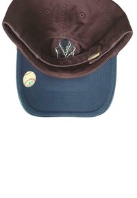 Baseball cap with brown crown, blue brim, adjustable strap, and a small baseball emblem on the brim against a white background.