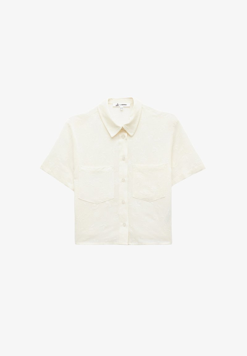 Short-sleeve, button-up shirt in cream. Featuring a subtle floral texture, two front pockets, and a classic collar design.