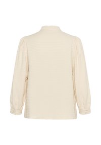 Cremfarbene Bluse mit langen Ärmeln, strukturiertem Muster, gerafften Ärmeln, gewellten Bündchen und hohem Kragen.