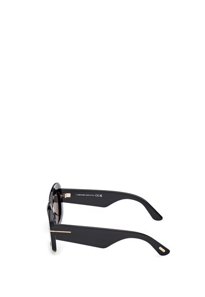 Schwarze Sonnenbrille mit runden Gläsern und dicken Rahmen. Mit einem markanten, angularen Design an den Bügeln und goldenen Akzenten.