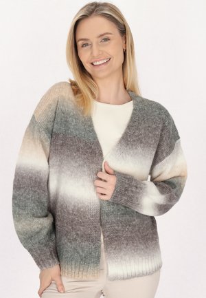 Sweter dzianinowy w gradientowe paski w odcieniach zieleni, szarości i kremu. Posiada dekolt w serek oraz otwarty przód, z luźnymi, długimi rękawami.