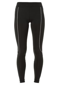 Leggings negros hechos de una tela elástica con una cinturilla alta. Presentan costuras blancas en contraste a lo largo de los lados y puños en los tobillos ajustados.
