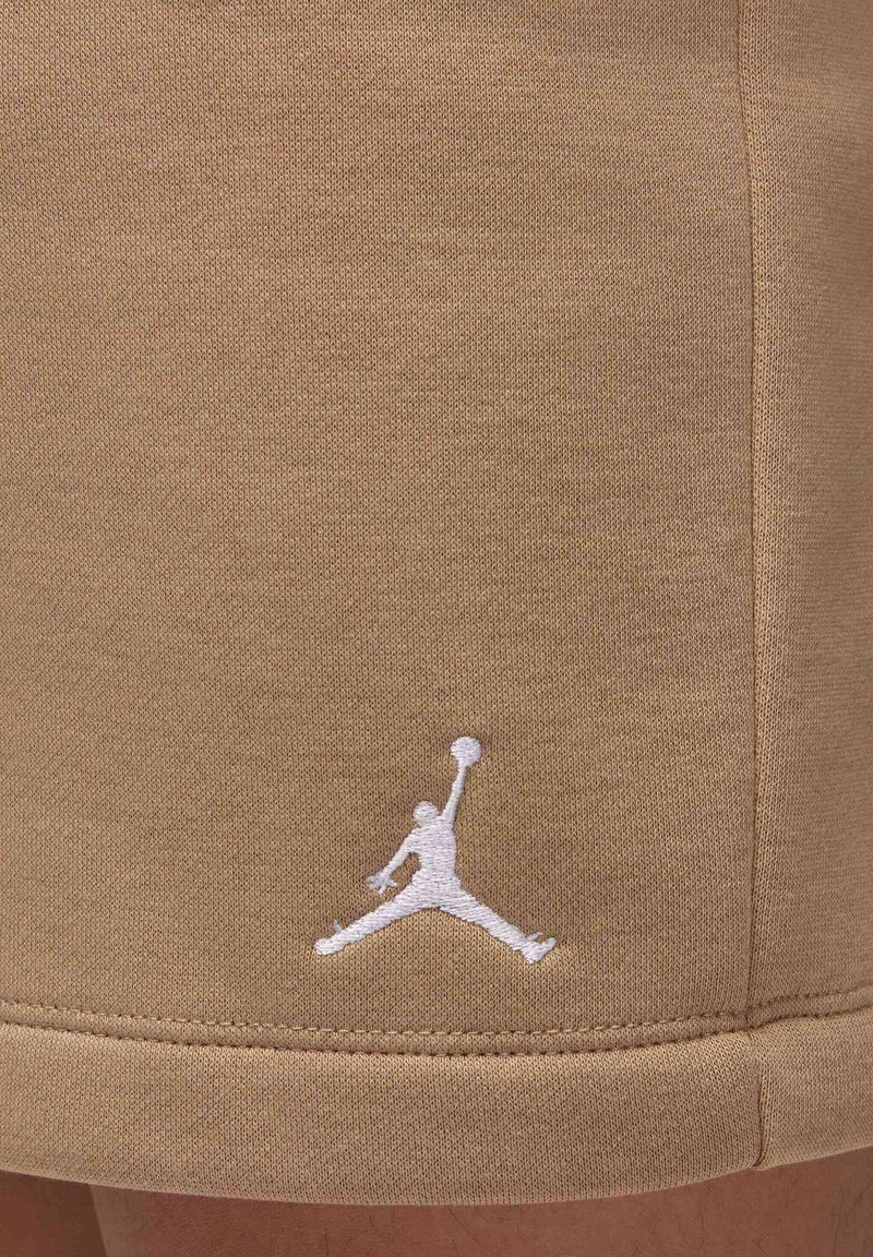 Shorts de sport en khaki en tissu mélangé coton. Avec un logo Jumpman brodé en blanc et une finition à ourlet standard.