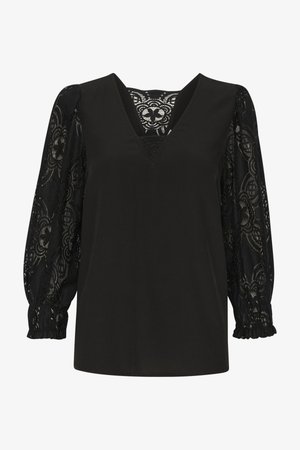 Melna blūze ar V-veida izgriezumu, mežģīņu bumba piedurknēm un gludu ķermeni. Piedurknes rotā sarežģīti ziedu raksti un elastīgi aproces.