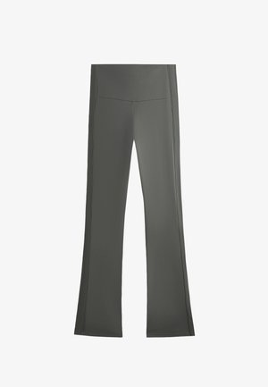 Grijze sportleggings met een flared vorm, een gladde textuur, een brede tailleband en subtiele zijkosten. Geschikt voor casual sportkleding.