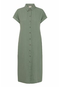 Vestito camicia in lino verde con maniche corte arrotolate, colletto e chiusura frontale con bottoni. Tessuto liscio e lunghezza fino al ginocchio.