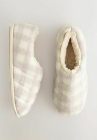 Quilted slippers in light gray and cream plaid. Soft synthetic fur lining and textured fabric exterior with a flat rubber outsole.